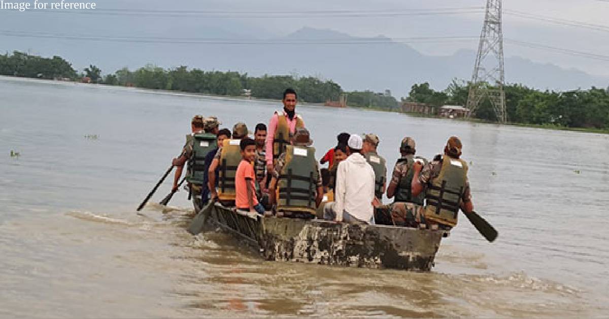 Parents use boats to bring children to primary school surrounded by water in Assam's Dhemaji